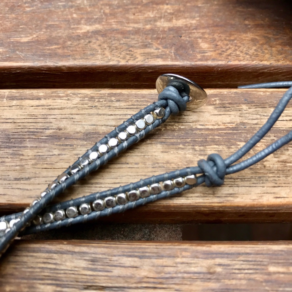 Stopper knots on leather bracelet